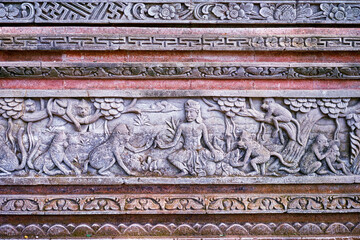 Ancient Stone Carving Depicting Religious Scene with Monkeys and Intricate Patterns