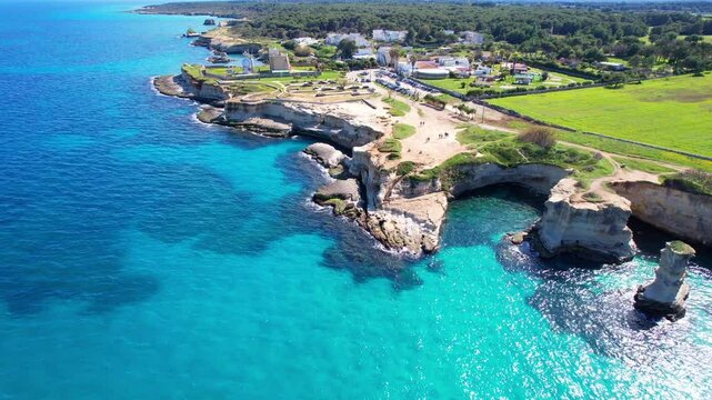 Faraglioni di Sant'Andrea - Torre Sant'Andrea, Salento, Lecce, Apulia, Italy - falling aerial photograph along the coastline