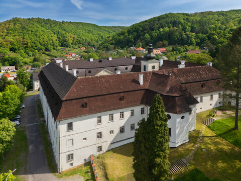 Aerial view of a sprawling estate with a vast courtyard, nestled amid rolling green hills and lush forests, Sv&Atilde;&curren;t&Atilde;&frac12; Anton, Bansk&Atilde;&iexcl; Bystrica Region, Slovakia.