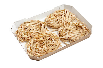 Freshly made fettuccine pasta arranged neatly in a white cardboard tray, showcasing its texture and...