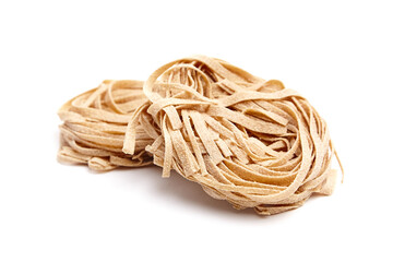 Freshly made pasta nests, showcasing a natural beige color and delicate texture, arranged...