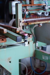 Industrial Machine with Sensor Module, Wiring, and Rusted Metal – Workshop Equipment Detail