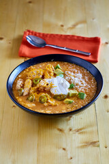 creamy chicken enchilada soup with avocado, jalapeno, and sour cream