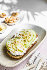 bruschetta with cottage cheese, pear, walnut and honey