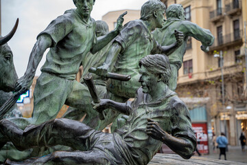 Celebration of San Fermin in Pamplona, Navarra, showcasing dynamic bull run sculpture