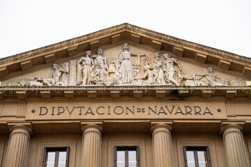 Architectural details of the historic Diputacion de Navarra building in Pamplona showcasing intricate sculptures and classical design
