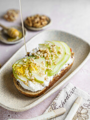 bruschetta with cottage cheese, pear, walnut and honey