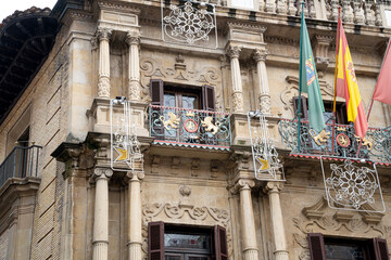 Historic building in Pamplona Navarra, Spain decorated for festivities during summer season