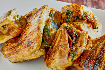 grilled pork chops stuffed with gouda cheese, bacon, spinach and sun dried tomatoes