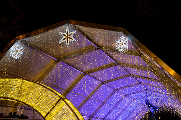 Festive lights illuminate a vibrant venue in Pamplona, Navarra during winter celebrations