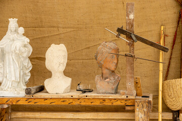 Traditional medieval sculpture tools displayed in Alcalá de Henares market during Madrid's Feria...
