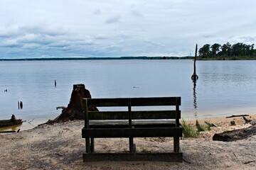 A wooden bench along the Goose Creek Trail offers a beautiful view of the Goose Creek.