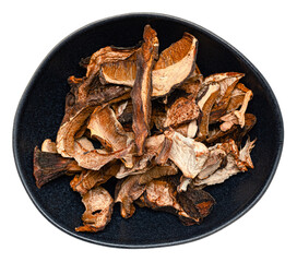 Dried wild forest mushrooms mix including chanterelles and porcini, organic dehydrated fungi for gourmet cooking, rustic textured food isolated on transparent background