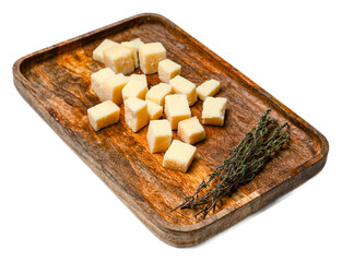 Aged parmesan cheese cubes on a rustic wooden platter with fresh herbs, closeup of hard italian dairy cheese, flavorful and textured culinary ingredient, transparent background