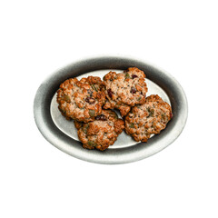 Homemade oatmeal cookies with nuts and dried fruits on a grey ceramic dish against a black background, closeup, delicious, textured, naturally sweetened, wholesome