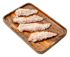 Raw breaded chicken tenders strips uncooked nuggets fillet on wooden tray isolated on transparent background