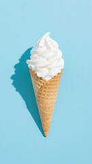 Vanilla ice cream cone with shadow on a light blue background in a studio shot, minimal style