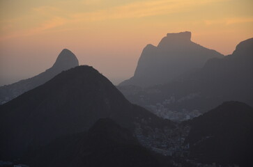 Sunset at night on Rio de Janeiro with city lights and the sea and the mountains
