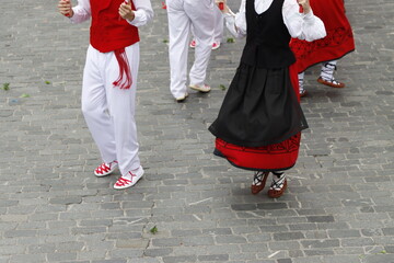 Basque dancers in a traditional costume during a folk event