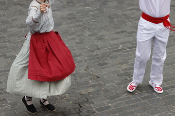 Basque dancers in a traditional costume during a folk event