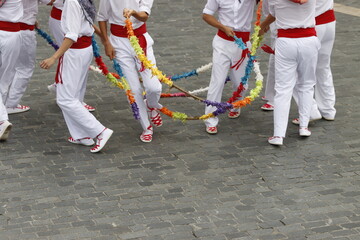 Basque dancers in a traditional costume during a folk event