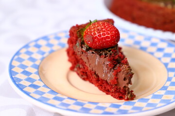 Fresh and delicious homemade strawberry chocolate cake with berries on the table