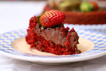 Fresh and delicious homemade strawberry chocolate cake with berries on the table