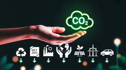 Hand holding green C O2 cloud above environmental icons