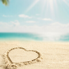 Close-up of golden sand with heart shape  drawn in the sand, space for product placement, turquoise sea and blue sky in tropical beach background – summer travel concept
