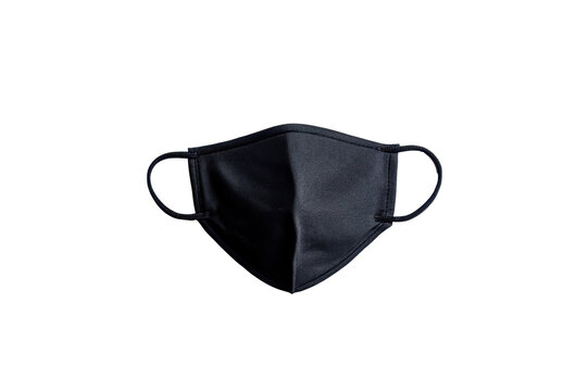 A plain black fabric protective face mask with elastic ear loops appears centered on a dark background isolate