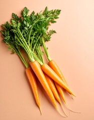 Fresh organic carrots with green tops on pastel background