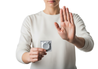 PNG cut out isolated background. A person wearing a white long-sleeved shirt is shown holding a sealed silver foil condom packet in one hand while the other hand is raised in a clear "stop" gesture.