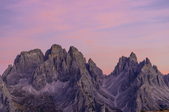 Dolomite Alps beautiful scenic landscape in summer. Dolomites mountains in Italian Alps, mountain summits and rocky tower peaks above green valley alpine view scene of Cortina'd'Amprezzo. Rocky towers