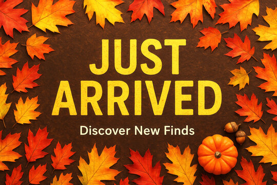 Autumn-themed announcement with vibrant orange and yellow leaves, a small pumpkin, and acorns surrounding bold text "Just Arrived" and "Discover New Finds" on a brown background.