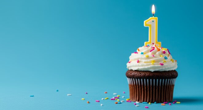 1st birthday. Celebrating First Birthday with a Cupcake and Number One Candle