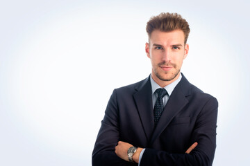 Portrait of a young business man standing against isolated bacgkround