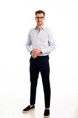 Portrait of a young business man standing against isolated bacgkround
