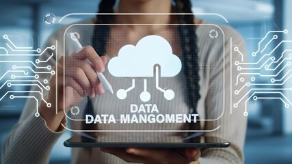 Woman Interacting with Cloud Data Management Interface on Tablet in Blue Toned Studio with Circuit Board Overlay and Data Text - Powered by Adobe