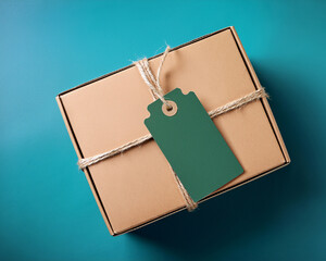 Brown leather notebook and blank paper bag with a business tag
