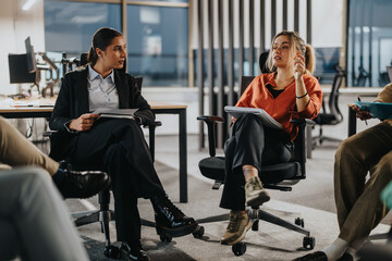 Business people collaborating in a modern office setting, exchanging creative ideas and strategies....