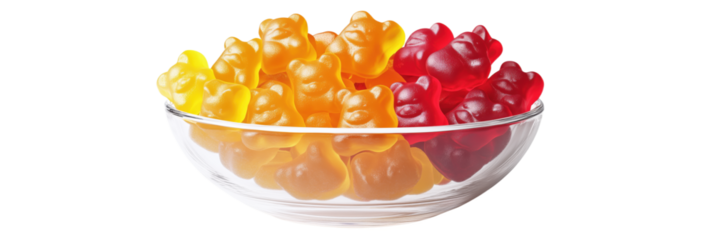 Colorful gummy bears in glass bowl showcasing vibrant yellow, orange, and red candies, isolated on transparent background