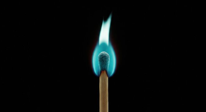 Single match ablaze, vibrant blue flame - Powered by Adobe