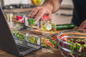 Man using futuristic digital screen to search healthy recipes and plant-based meal ideas while preparing fresh vegetables in a modern home kitchen