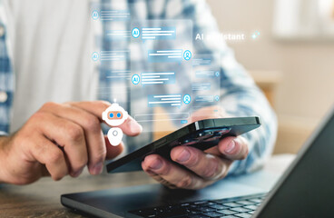 Closeup of male hand using smartphone with AI chatbot assistant interface Holographic virtual bot...
