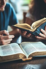 Christian couple or group reading study the bible together and pray at a home or Sunday school at church. concept studying the word of god.
