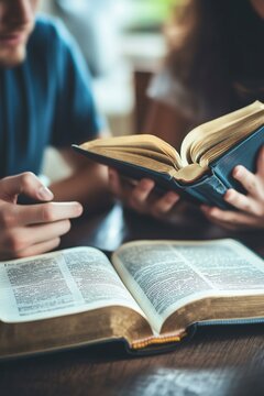 Christian couple or group reading study the bible together and pray at a home or Sunday school at church. concept studying the word of god.