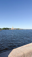 Body of water with a bridge in the background