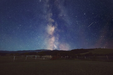 Milky Way stars and rural countryside silhouettes