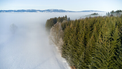 View of the snowy landscape of the Krkonoše Mountains during an inversion