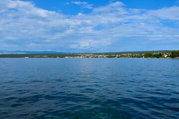 Obraz premium View of the coastal town of Malinska at Krk on the coast of the Adriatic sea in Kvarner, Croatia